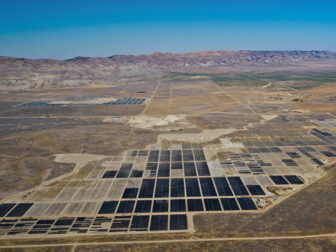 Central Valley solar ranch in desert area against blue sky backdrop